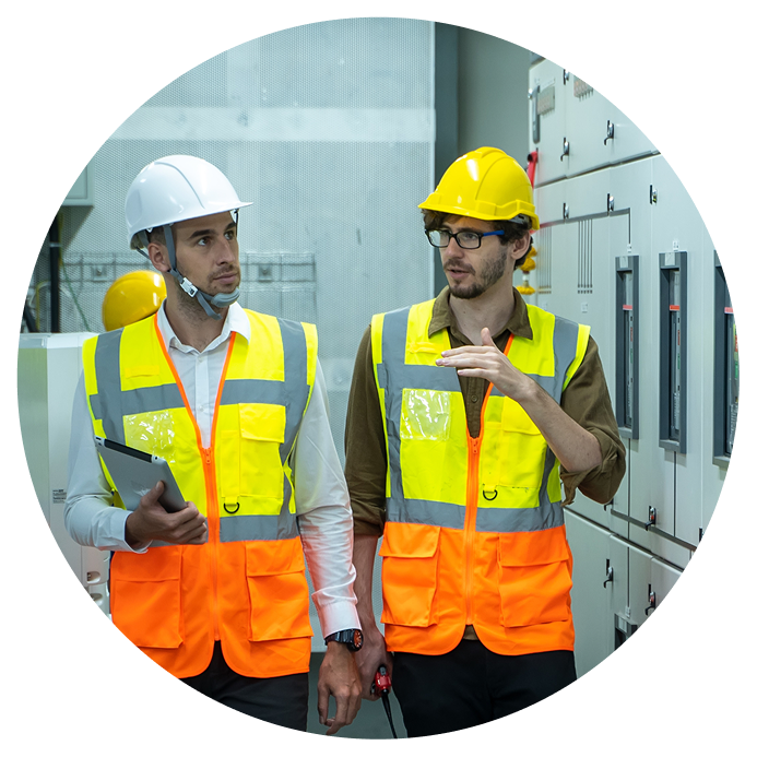 Two facility workers walking and talking