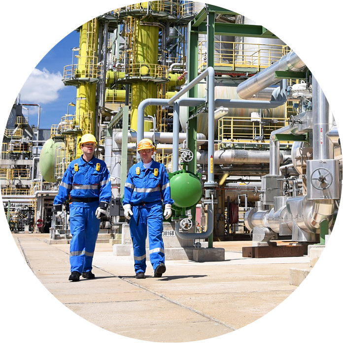 two workers on a nuclear facility walking